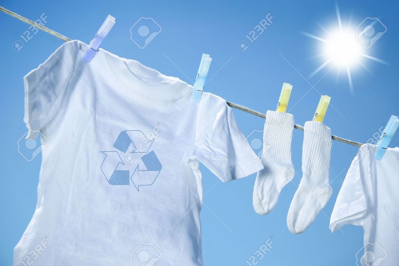 2639262-Eco-friendly-laundry-drying-on-clothes-line-against-a-blue-sky-with-sun-Stock-Photo